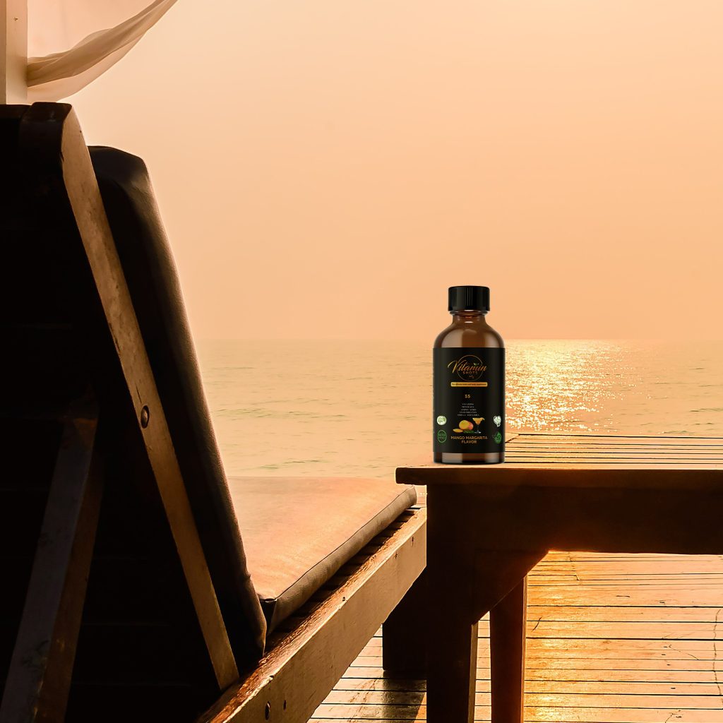 Vitamin Shots Bottle Photo on Oceanfront table close up 2