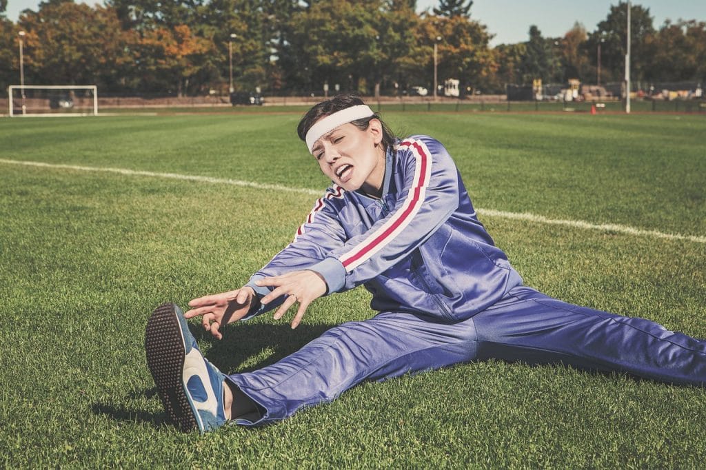 stretching, nature, sports, woman, athlete, fitness, sport, healthy, exercise, workout, young, female, body, lifestyle, training, fit, health, stretch, people, active, girl, adult, person, sportswear, athletic, gym, exercising, physical, sporty, white, pilates, leisure, tracksuit, track and field, shoes, headband, grass, field