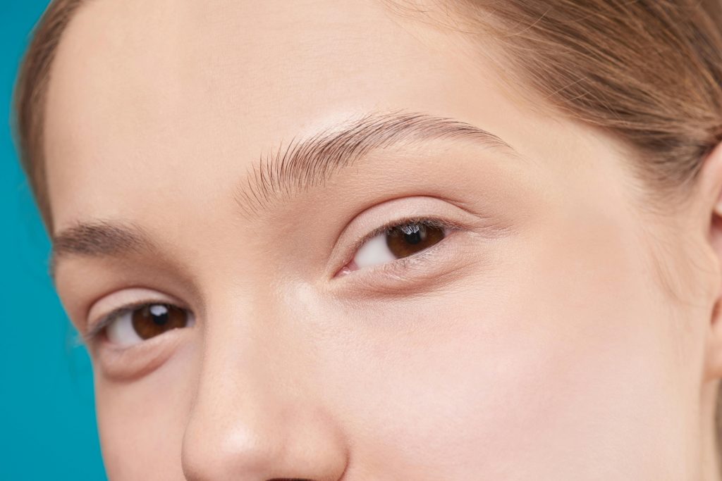 A close-up photo showcasing a woman&#039;s natural skin and eye detail, emphasizing natural beauty.